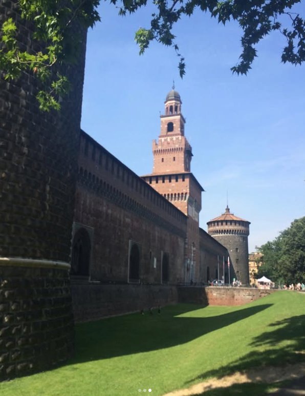 The outer walls above the grassed moat